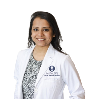 Smiling female doctor in white coat.