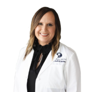 Smiling woman wearing medical white coat.